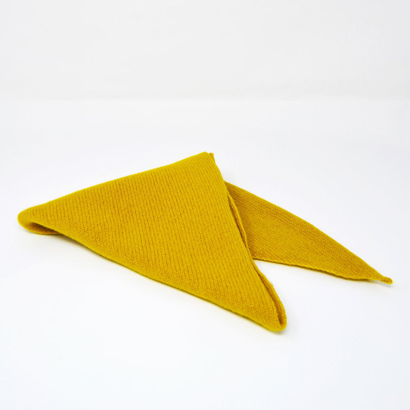 Mustard yellow knitted triangle scarf.