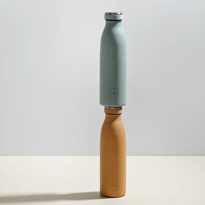 Two stacked Ayda insulated water bottles; one light blue, one mustard yellow.