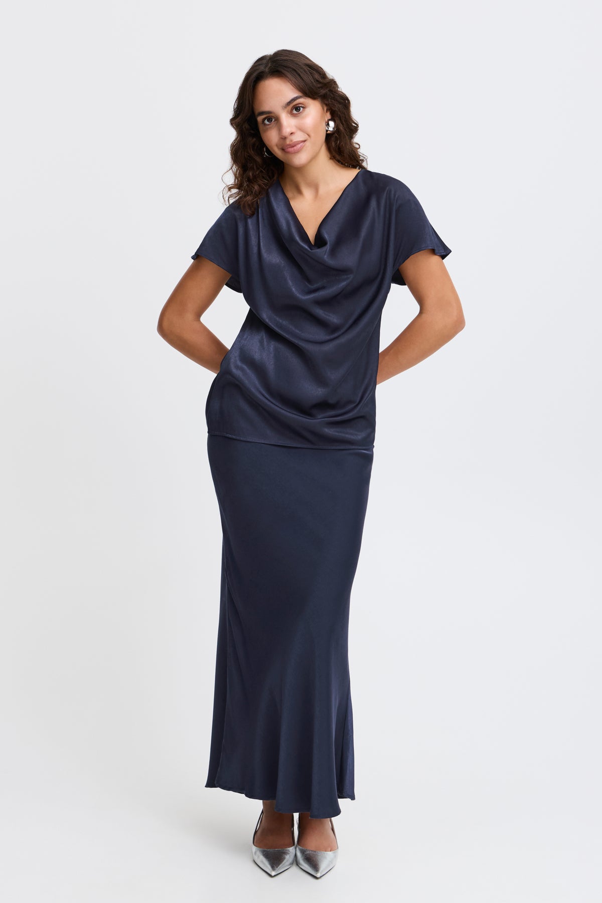 Navy blue cowl-neck satin top and matching maxi skirt.