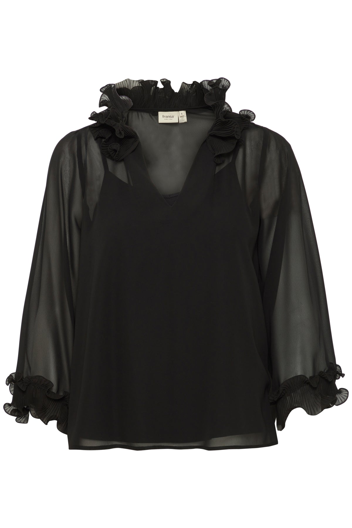 Black sheer blouse with ruffled collar and cuffs, layered over a solid black v-neck top.
