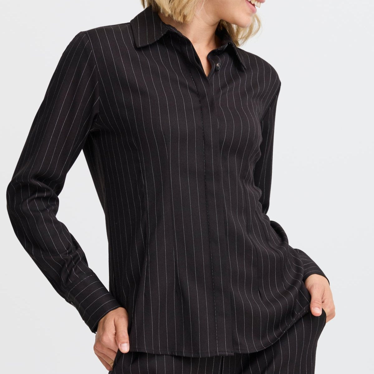 Black pinstripe long-sleeve button-down shirt.