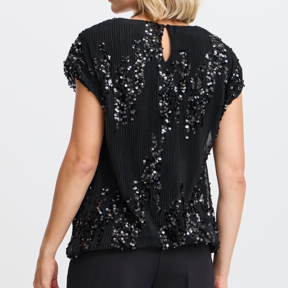 Black pleated sequined top with short sleeves and a keyhole back.