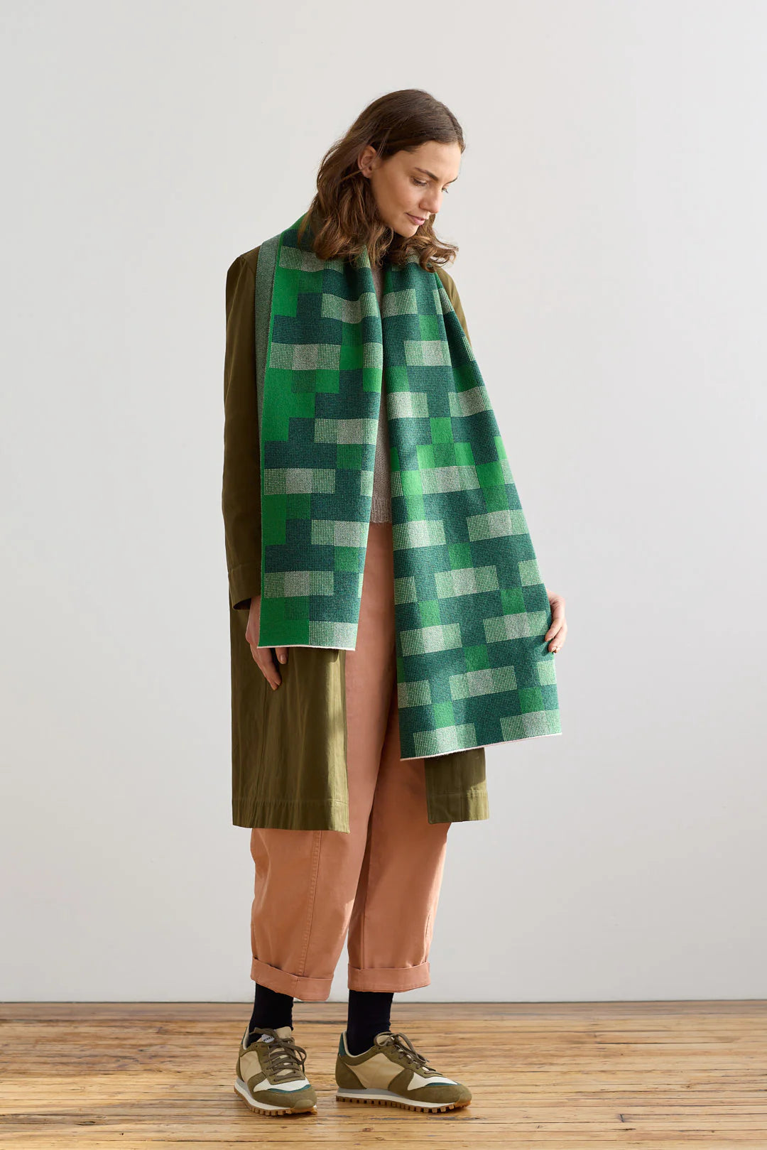 Green and off-white geometric patterned wool scarf.