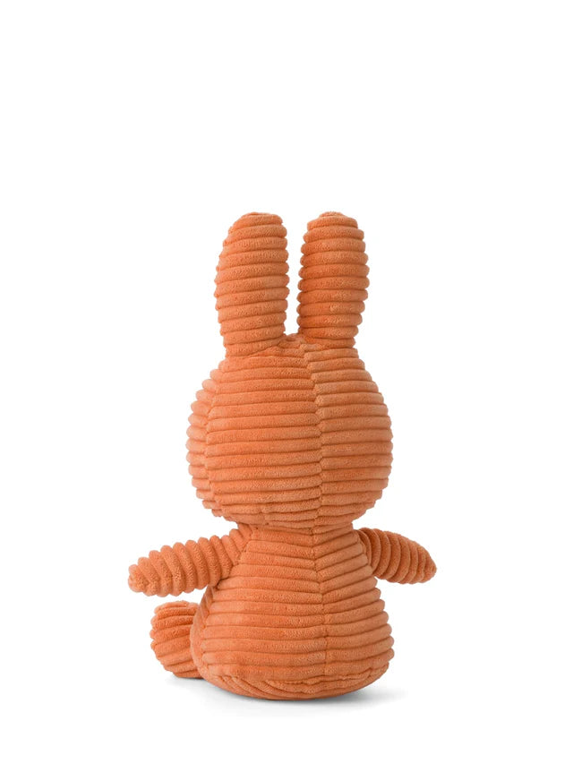 Orange plush toy with a textured surface on a white background