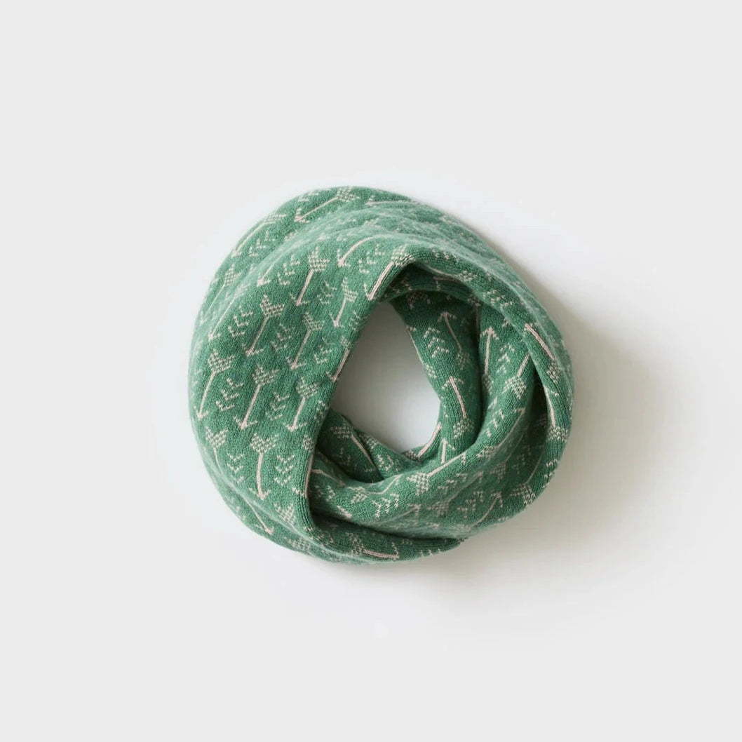 Green knitted infinity scarf with a subtle cream-colored arrow pattern.
