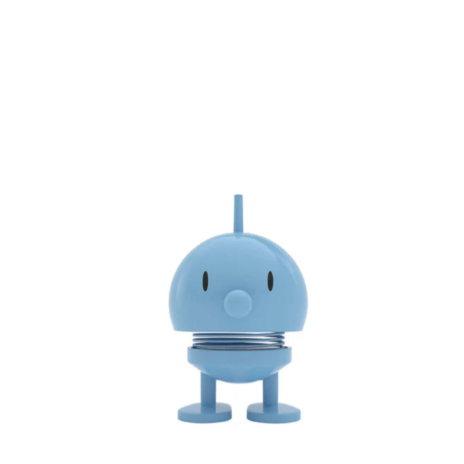 Small blue character with a spring on a white background