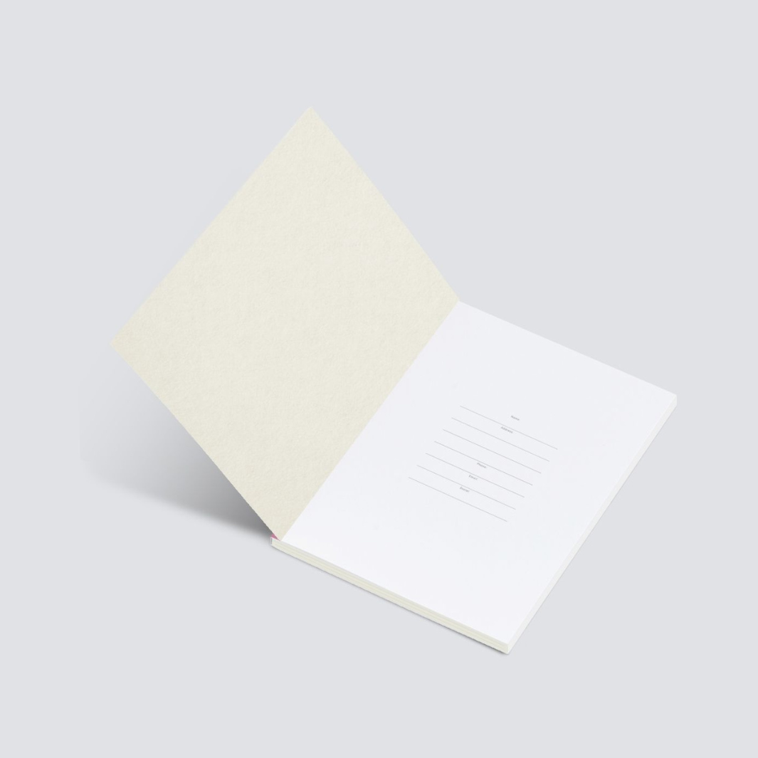 Open blank notebook with off-white textured cover and lined interior pages.