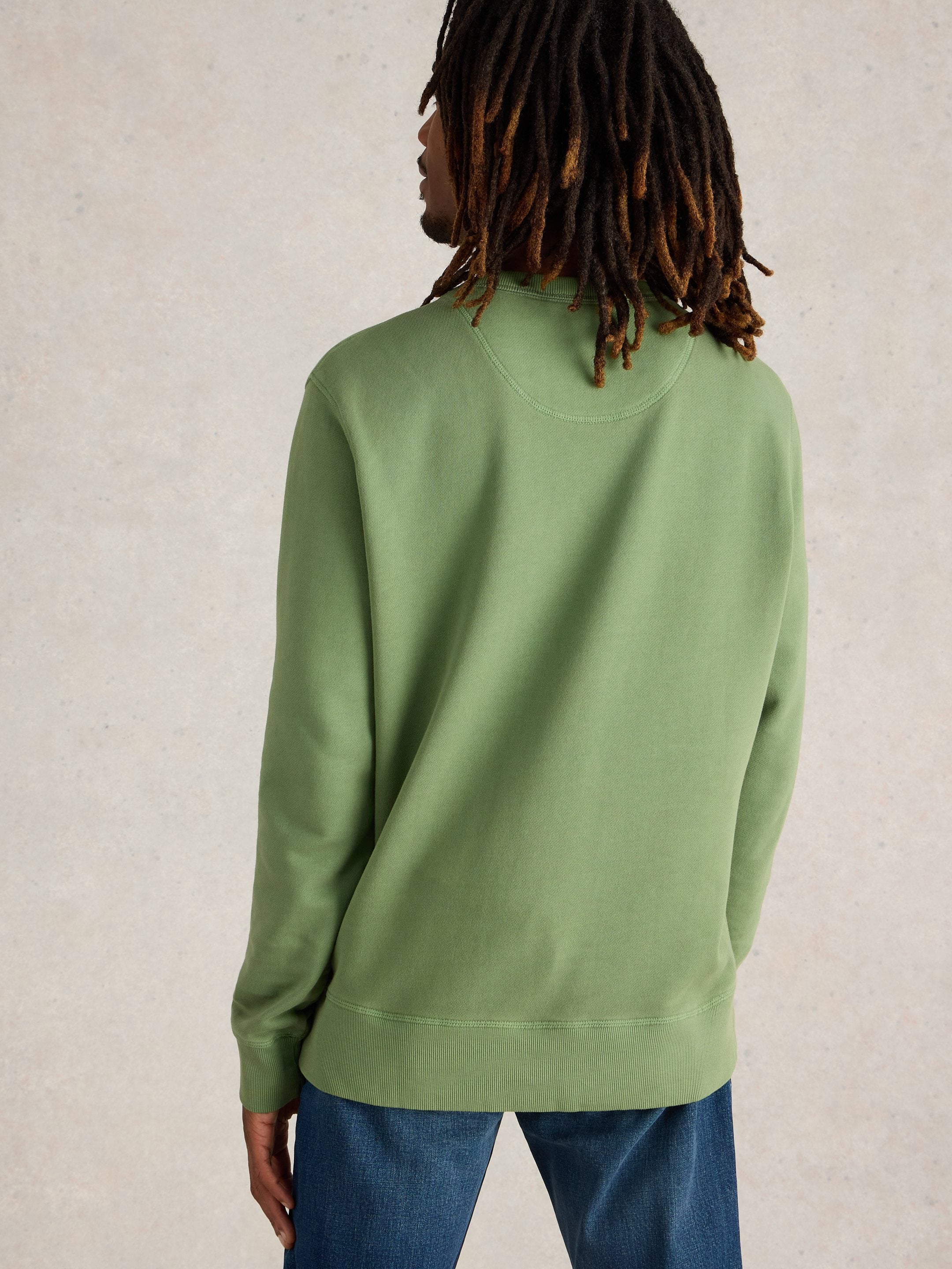 Sage green crewneck sweatshirt, long sleeves, ribbed cuffs and hem. Back view.