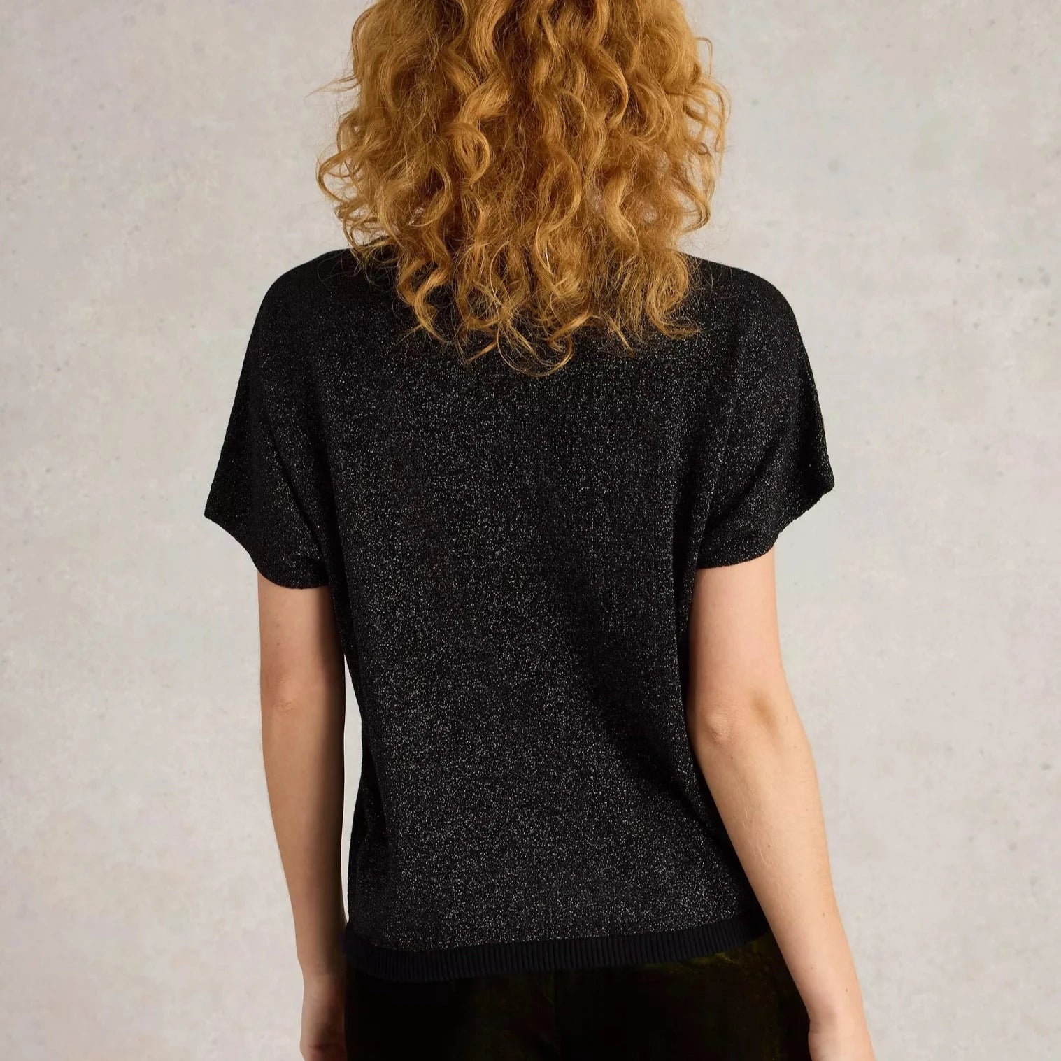 Black glitter short-sleeved knit top.