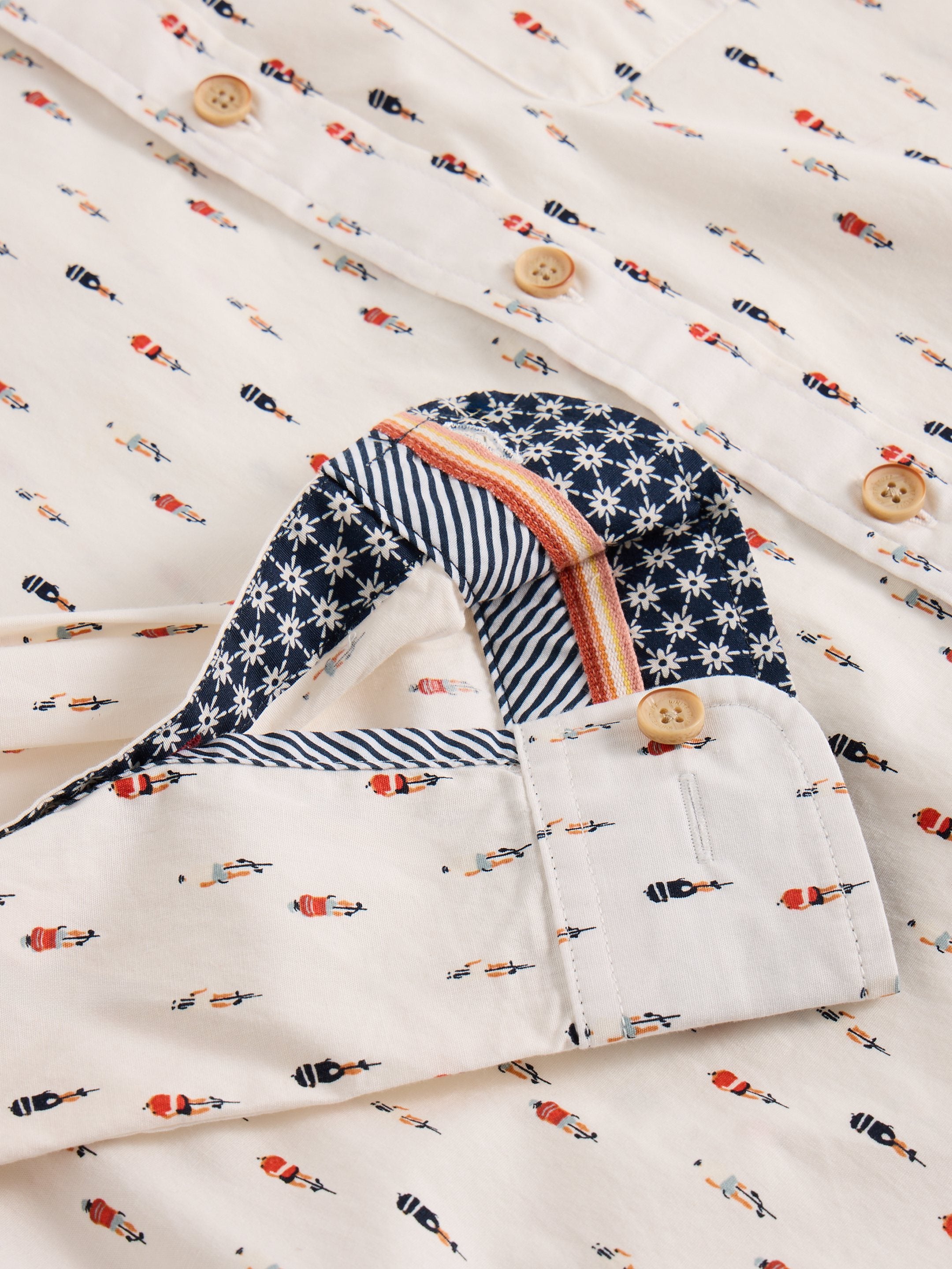 Off-white men's shirt with repeating pattern of cyclists.