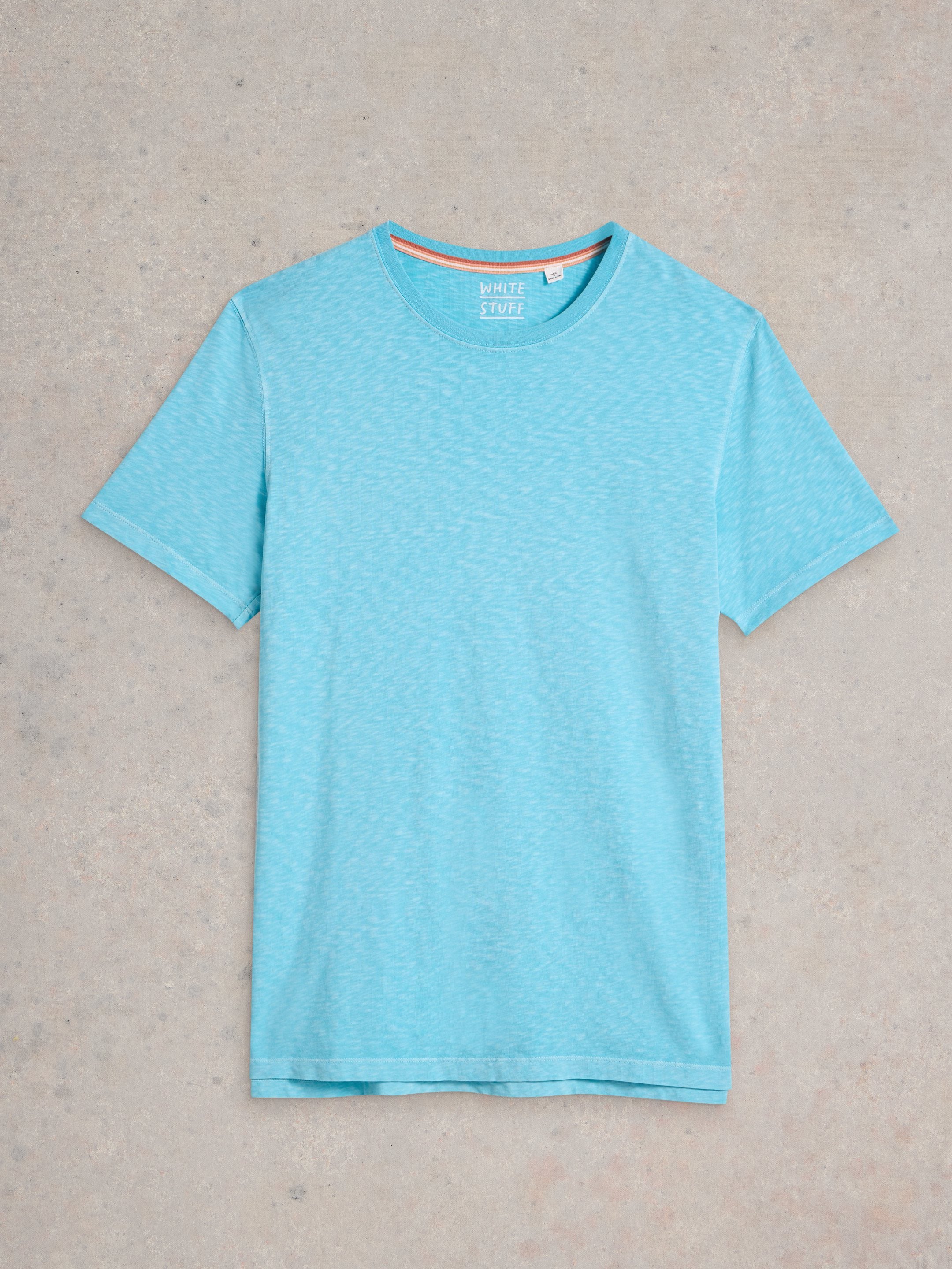 Light blue short-sleeve crew neck t-shirt with subtle heather texture and "White Stuff" label.