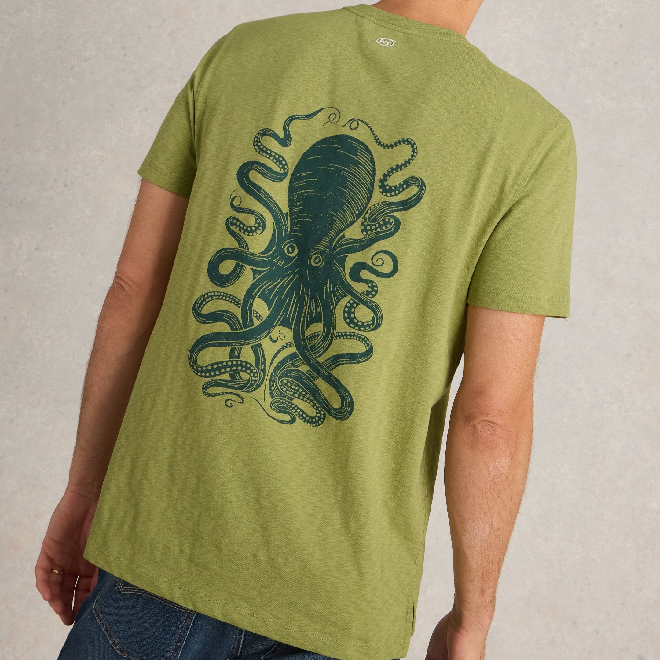 Olive green short-sleeve t-shirt featuring a dark green octopus print on the back.