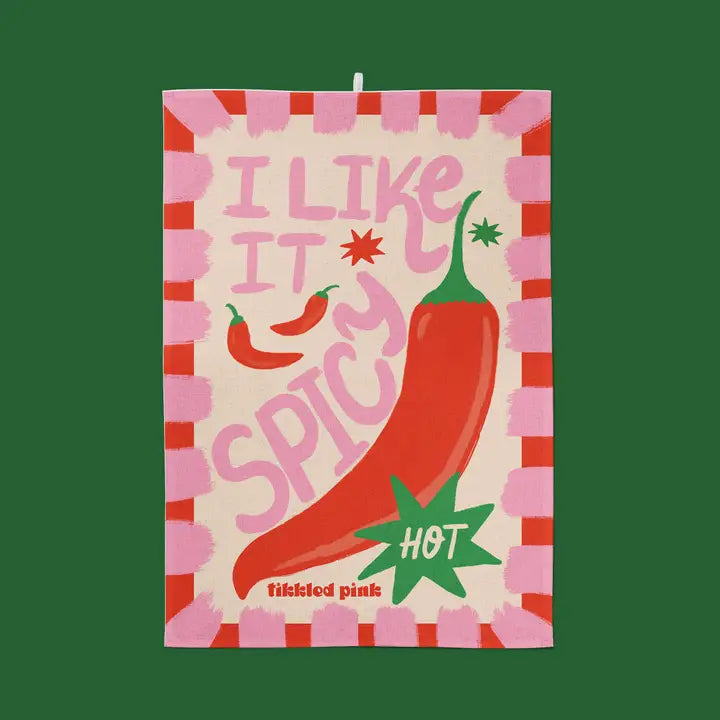 Tea towel featuring a large illustrated red chili pepper, the text "I like it spicy," and a "Hot" label.