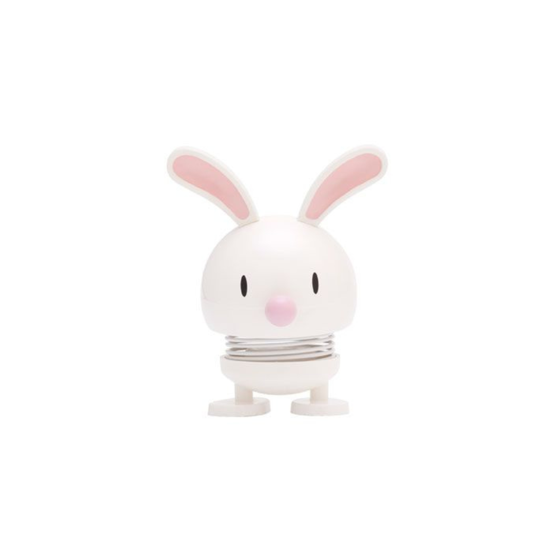 White rabbit-shaped spring toy with pink ears and nose.