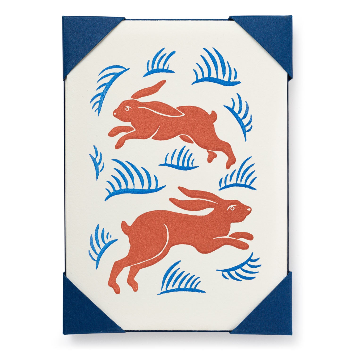 Two terracotta rabbits leaping across an off-white background adorned with blue stylized foliage.