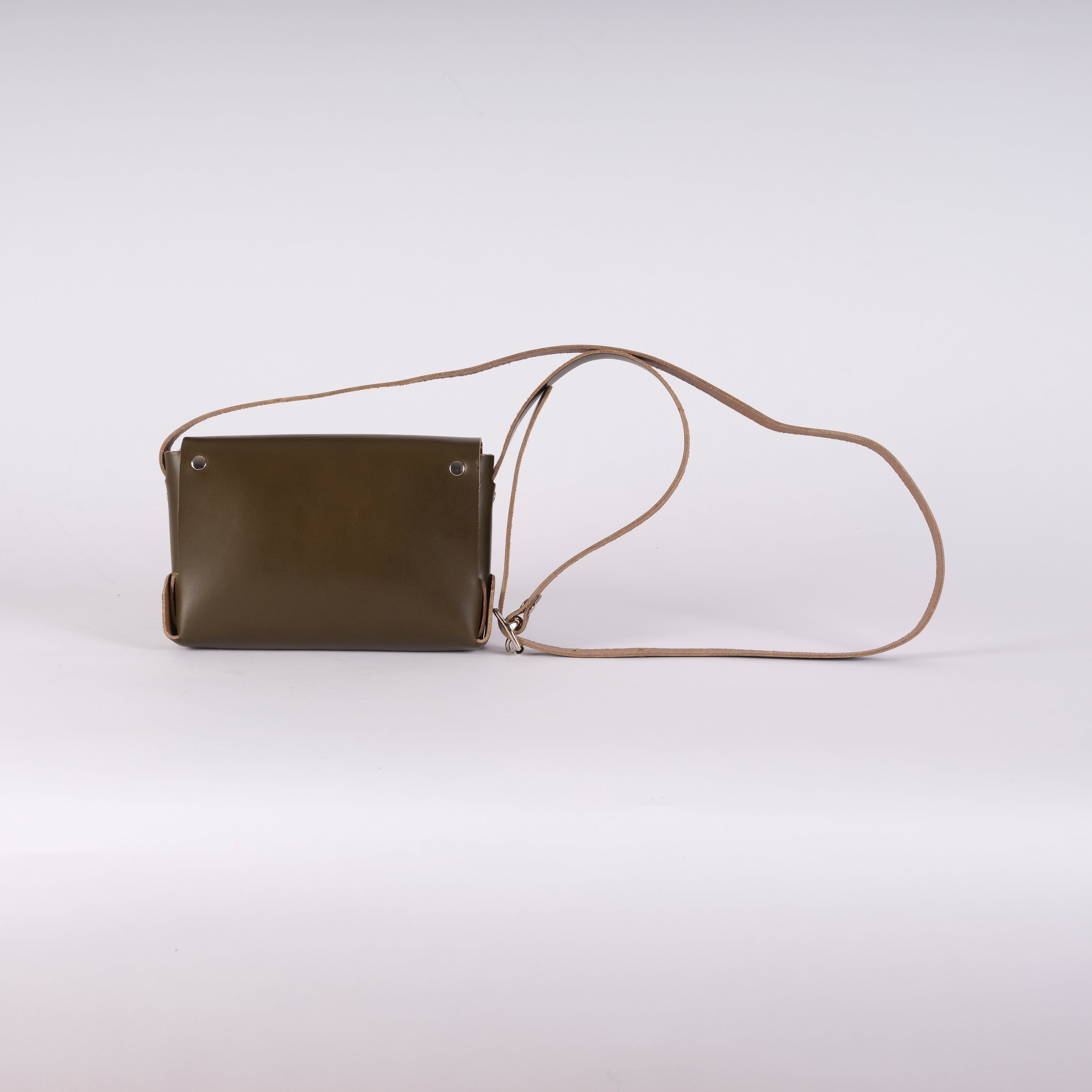 Olive green leather crossbody bag with a light brown leather strap.