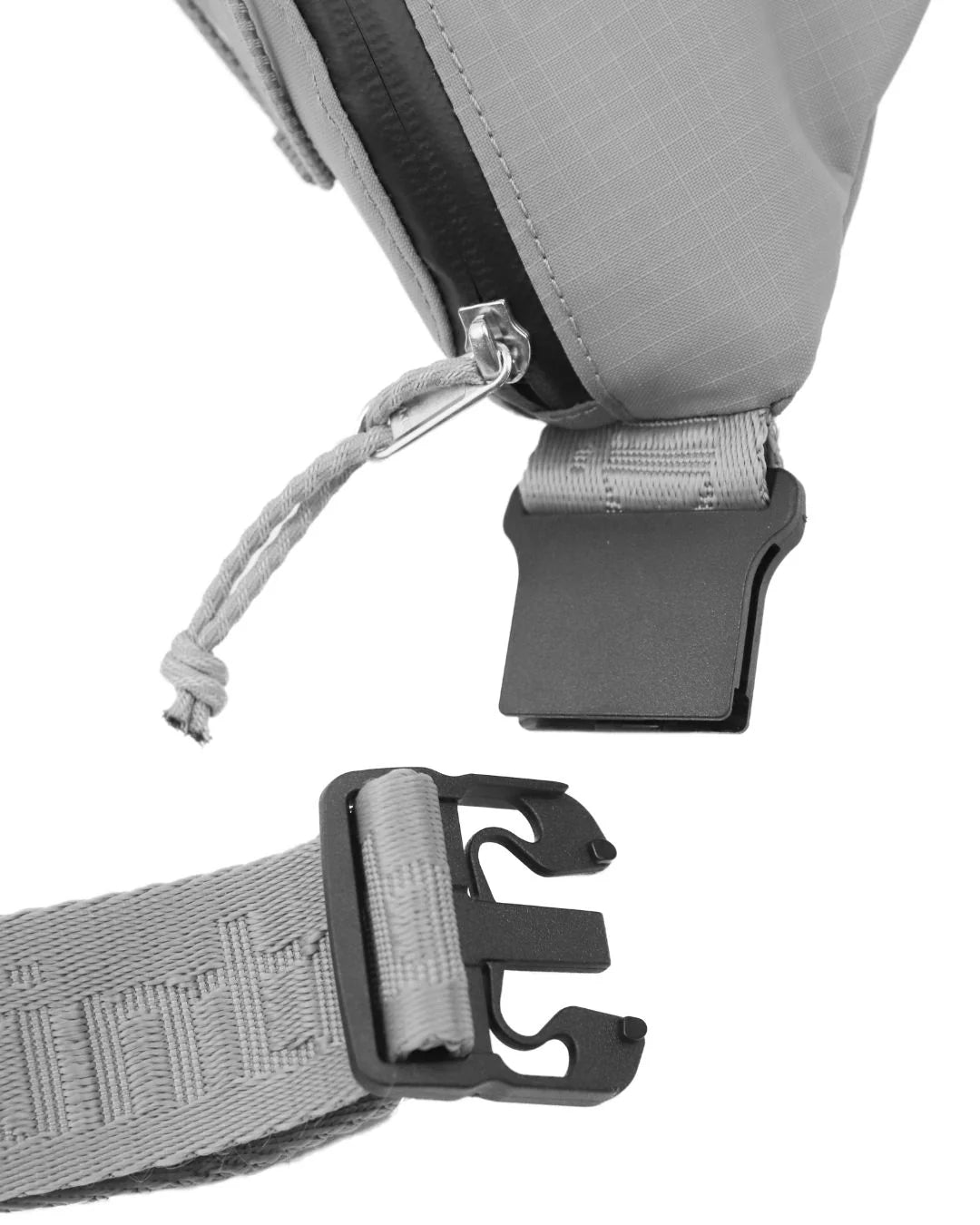 Gray fabric waist bag with black zipper, adjustable straps, and plastic buckles.