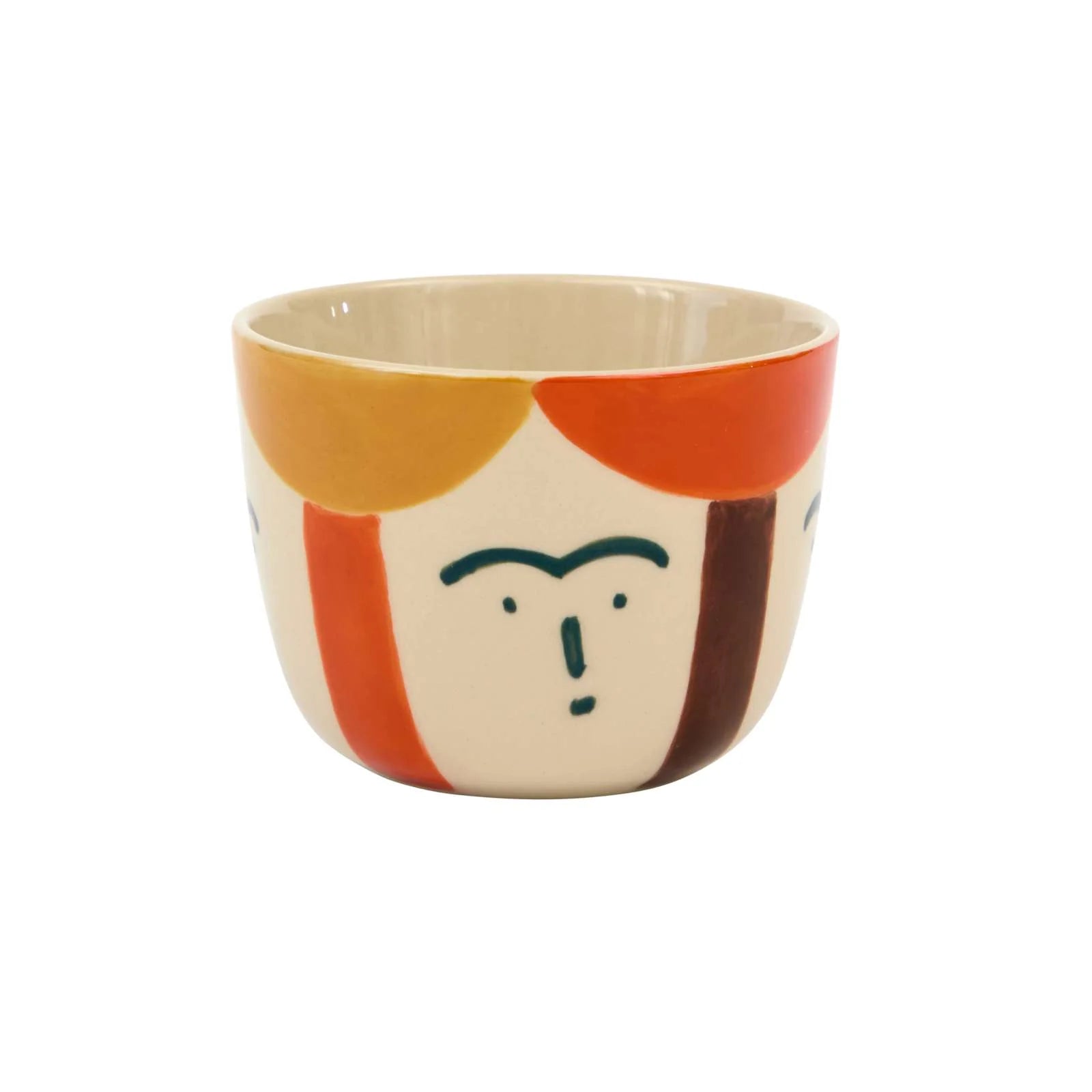Ceramic cup with a face design on a white background