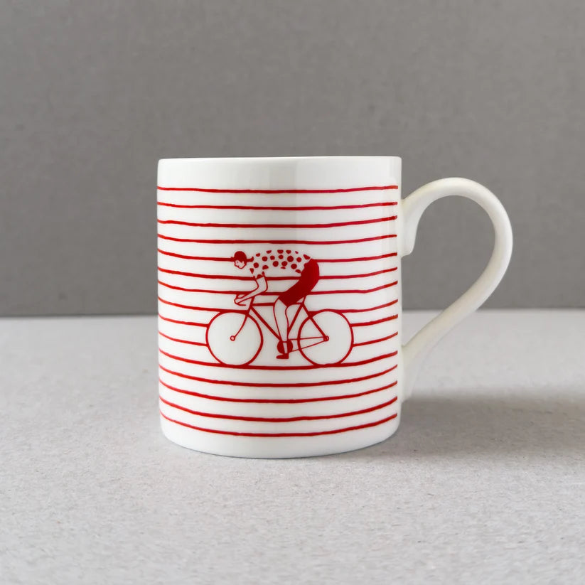 White mug with red horizontal stripes and a cyclist illustration.