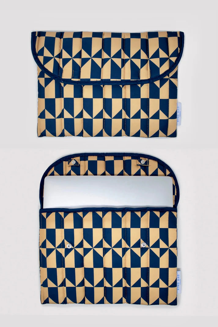 Padded laptop sleeve with a geometric navy and gold pattern.  The sleeve is shown open and closed.