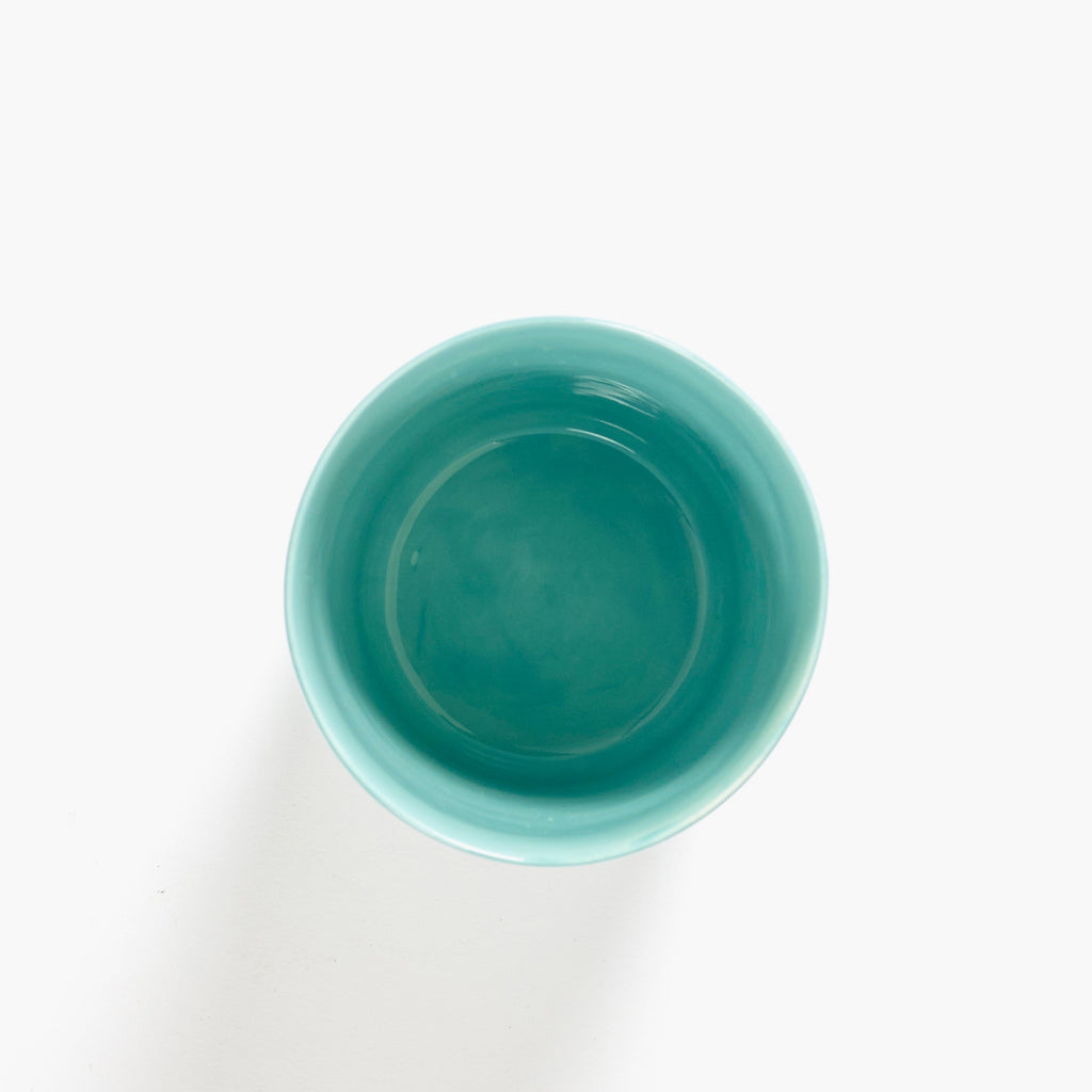 azure tea cup, with red organic stripes, from the FEAST collection, designed by British-Israeli chef Yotam Ottolenghi, for Belgian design brand Serax.