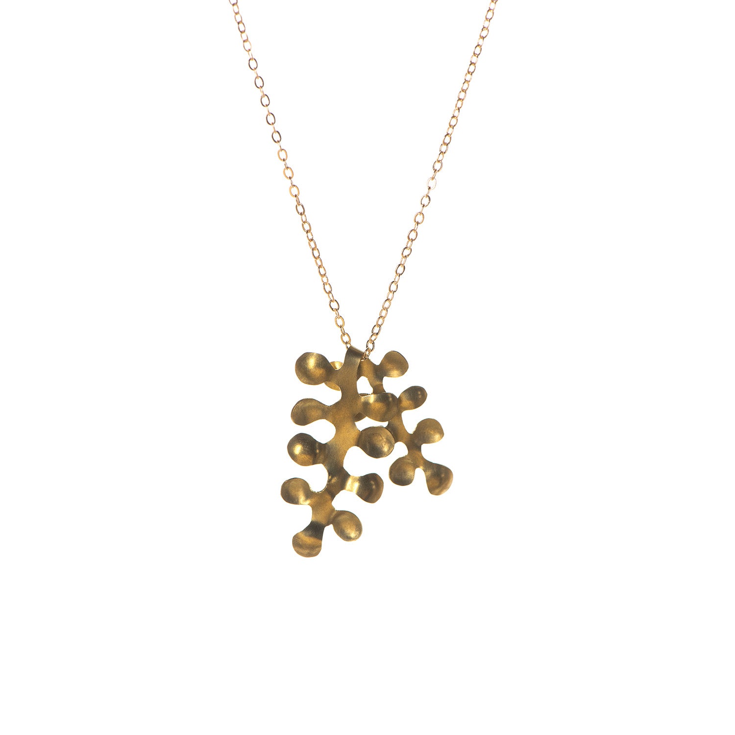 Gold necklace with abstract, branching pendant.