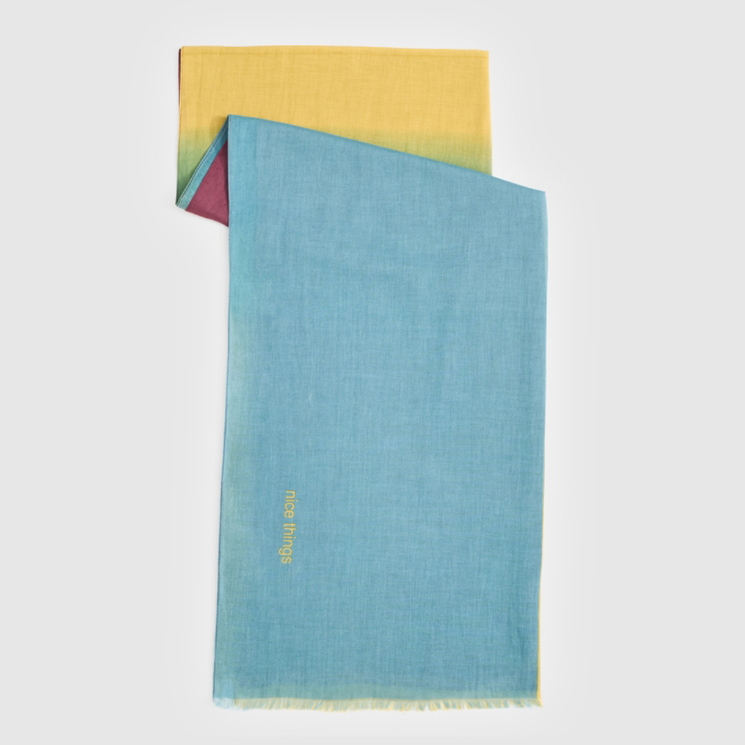 Ombre gradient scarf in teal, yellow, and burgundy.  Features "nice things" embroidered in yellow.