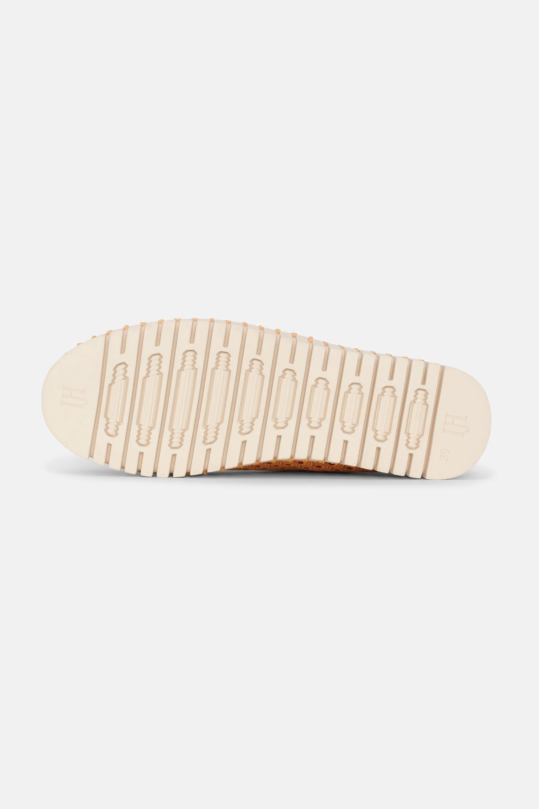 Beige shoe sole with off-white textured tread, showing size 38. The sole features a repeating pattern and small beige dots along