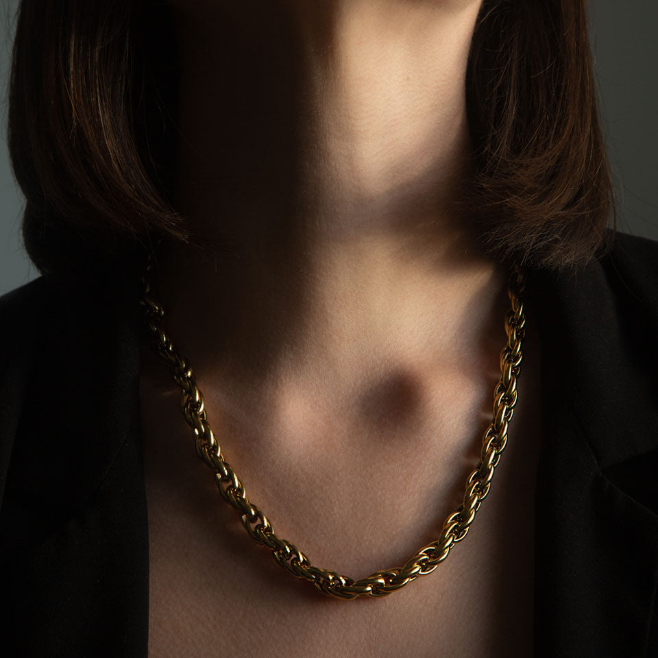 Gold rope chain necklace; thick, chunky links.