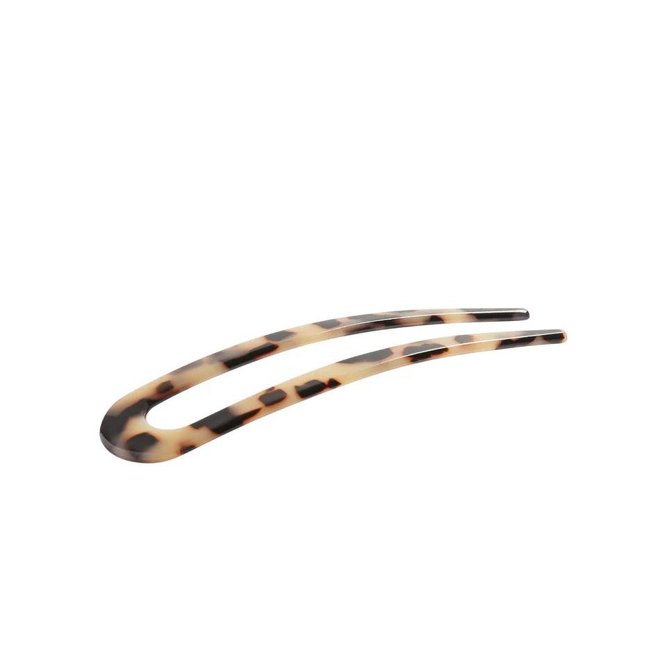 Tortoiseshell hair clip on a white background