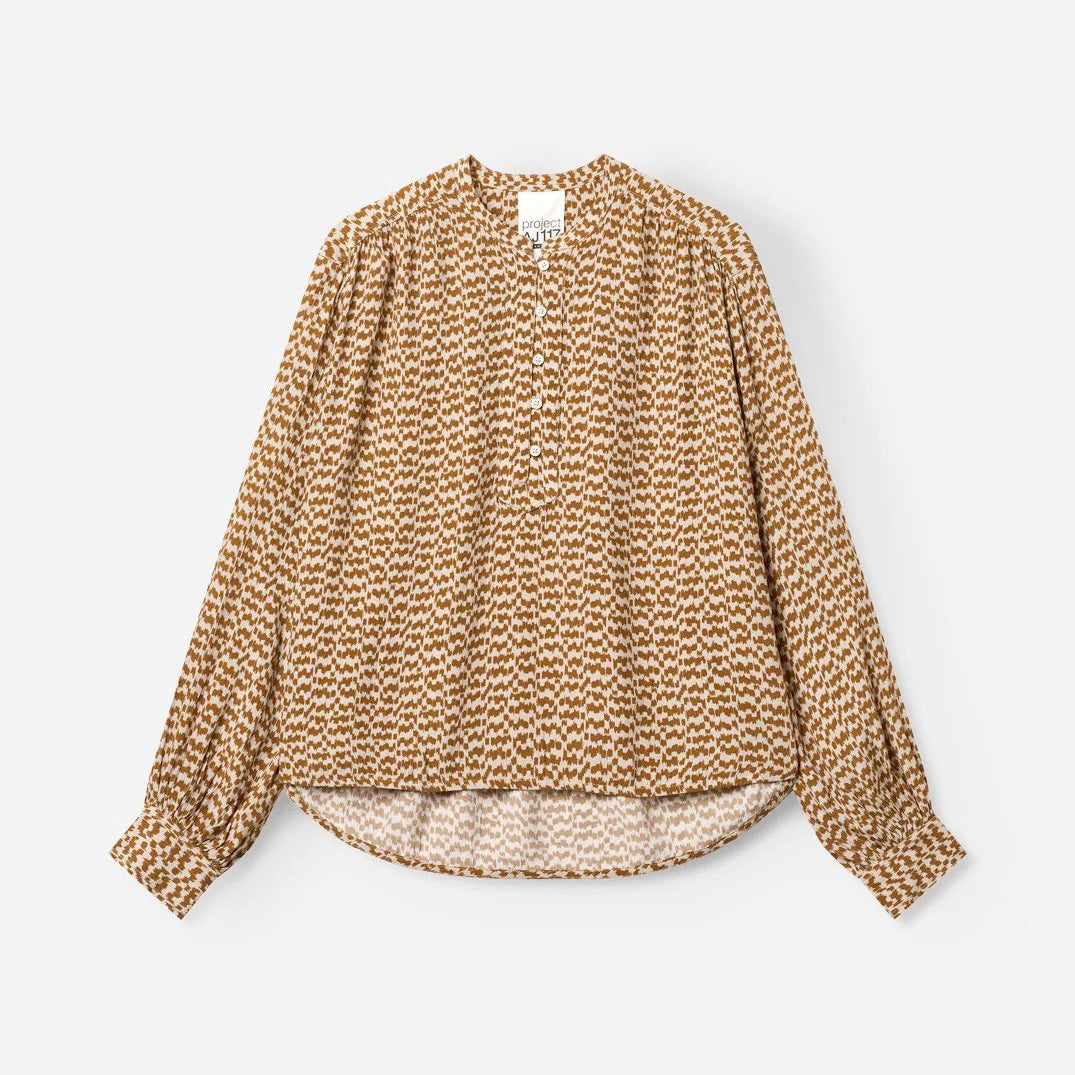 Textured blouse with a subtle pattern on a white background