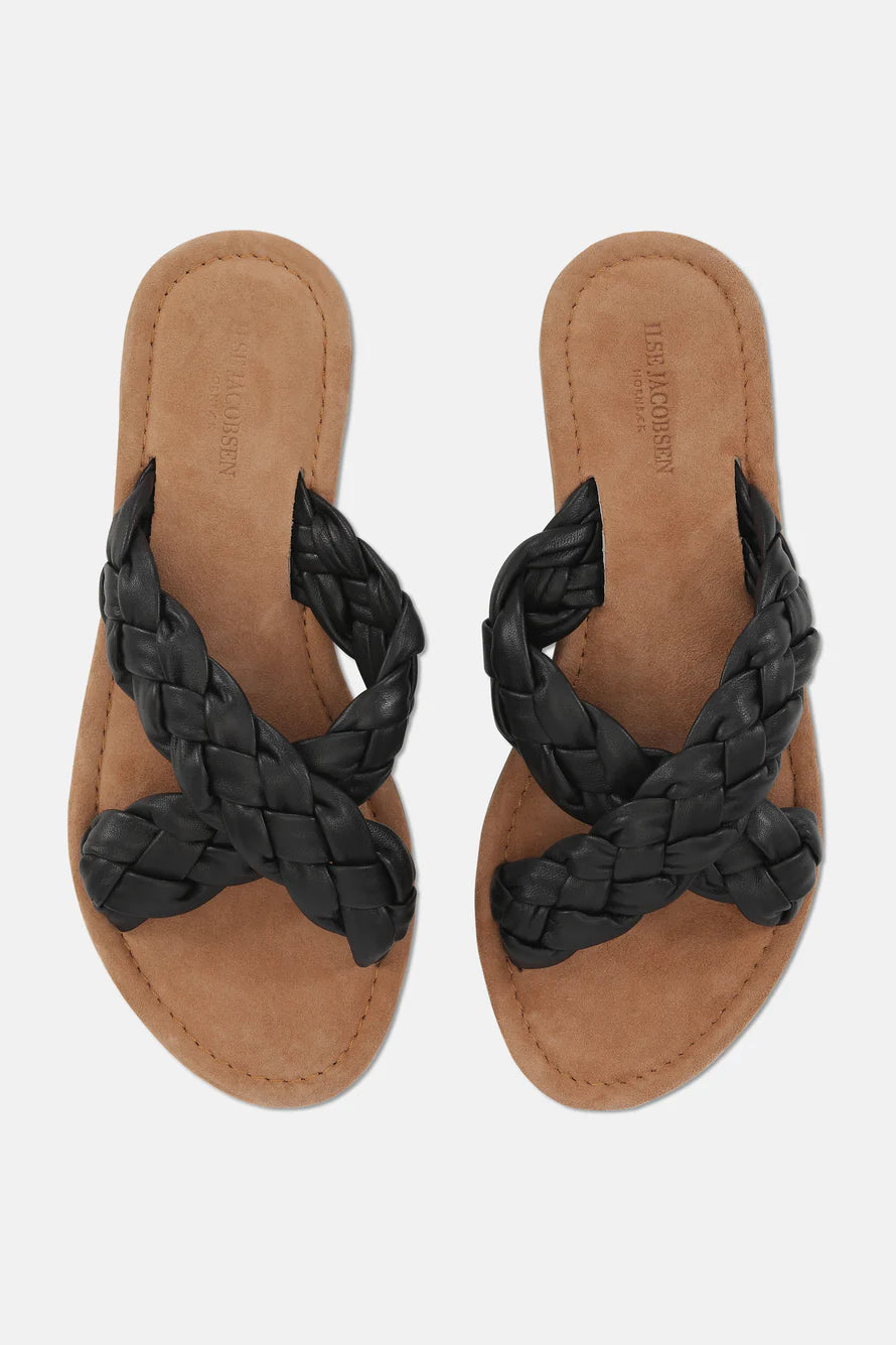 Pair of black leather Liesl Jacobsen braided crossover sandals with tan suede insole.
