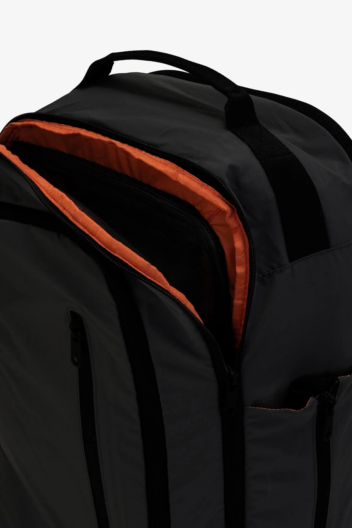 Dark gray backpack with black accents and orange interior lining.