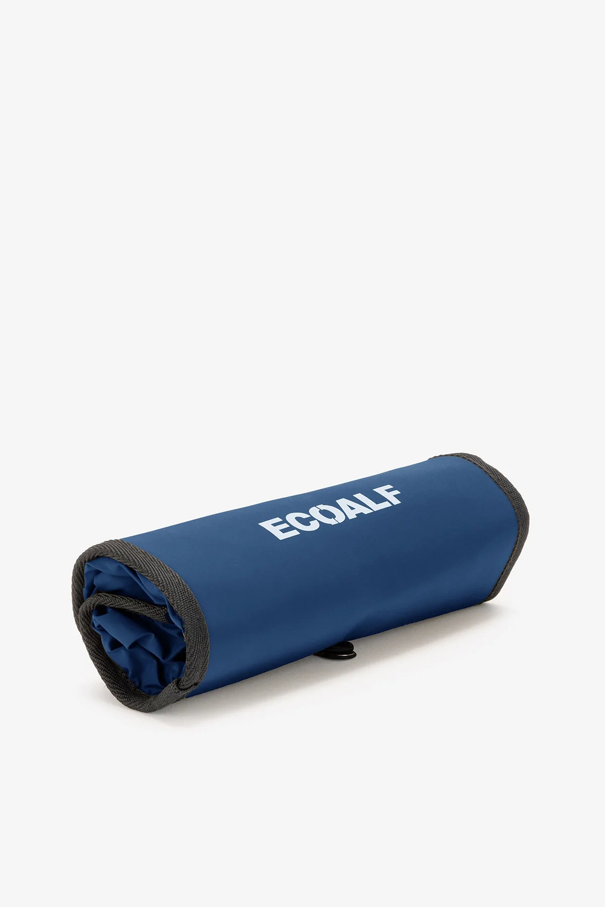 Rolled-up navy blue ECOALF reusable shopping bag with gray trim.