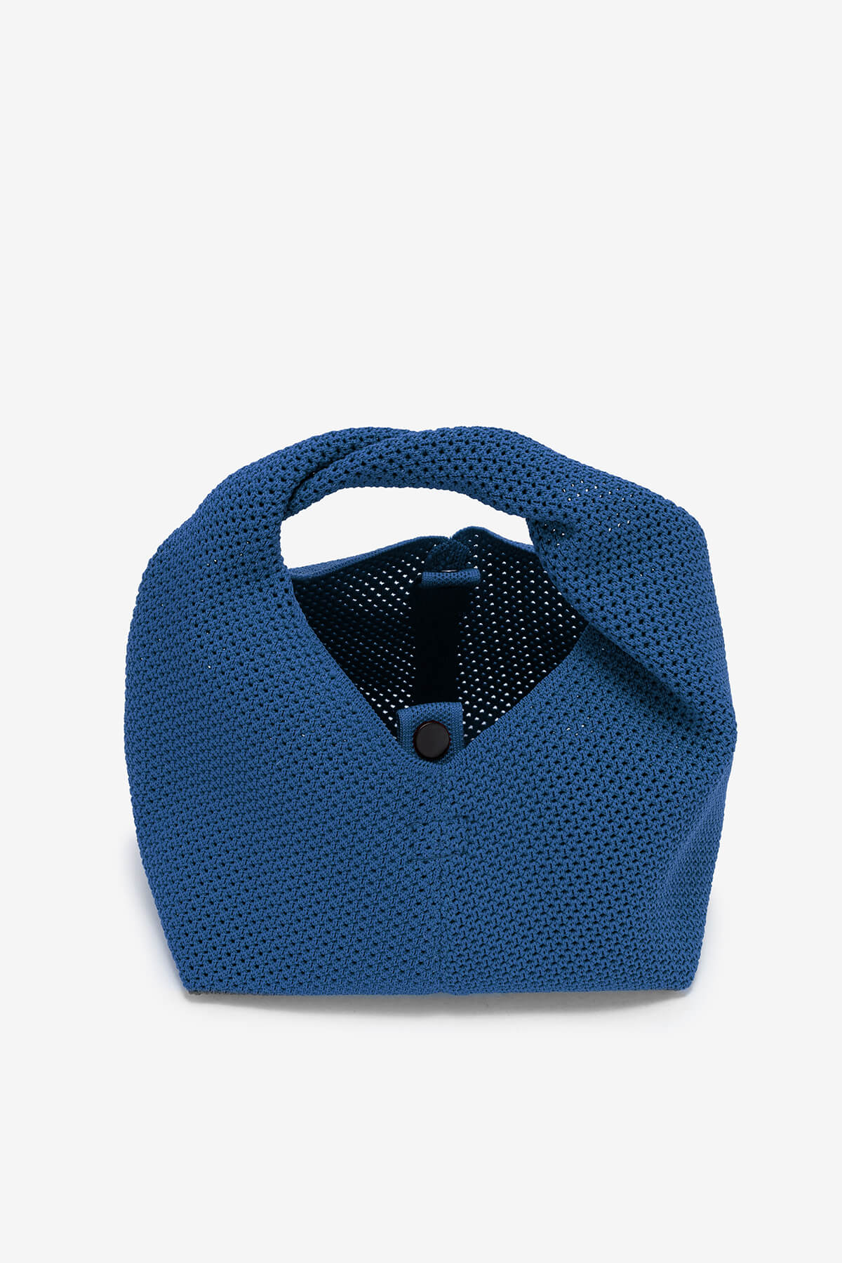 Blue knitted tote bag with a knotted handle and small button closure.