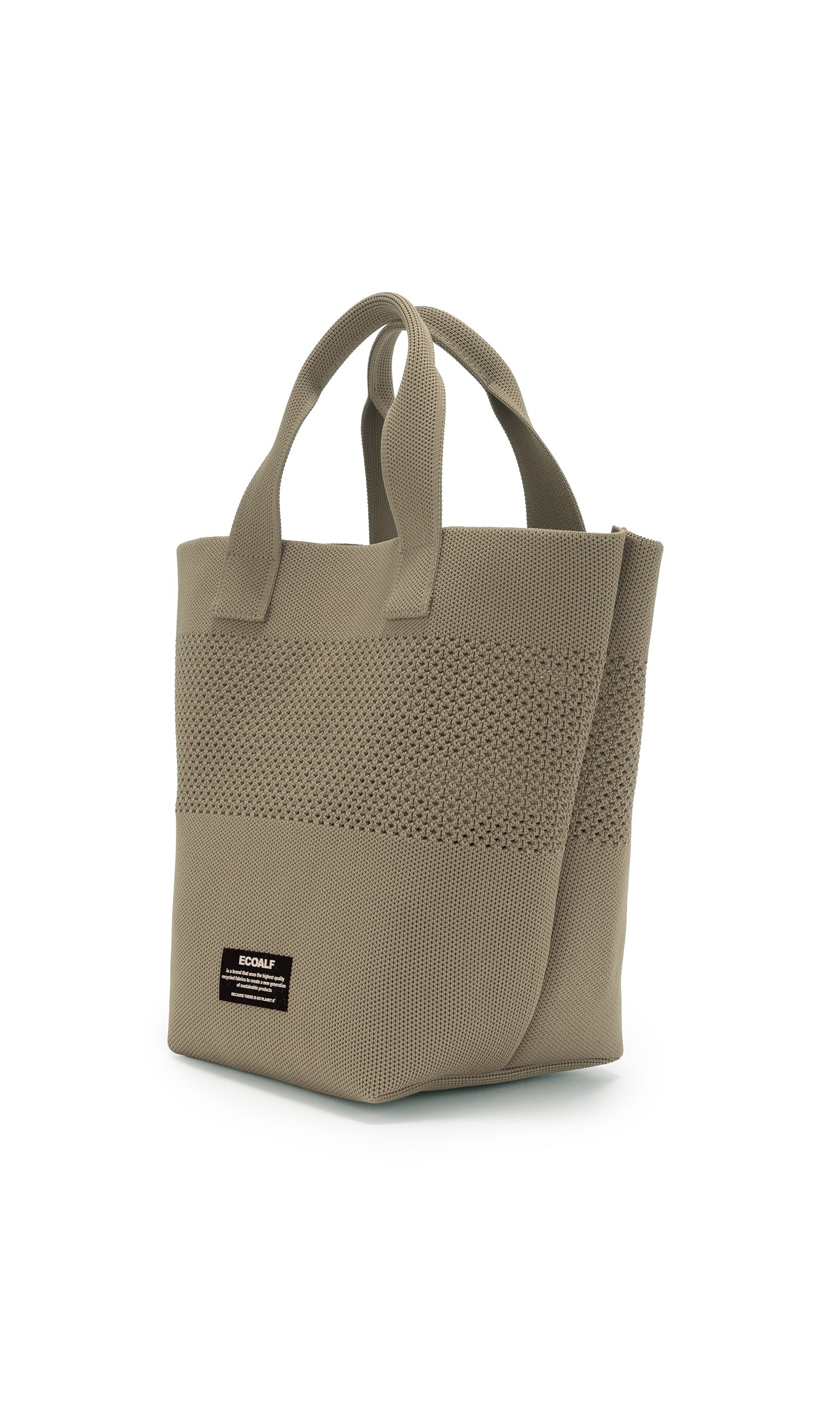 Taupe knitted tote bag with double handles and a small brand label. The bag has a textured, open-weave pattern.