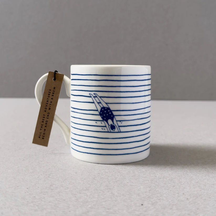 White mug with blue horizontal stripes and illustration of a diver.