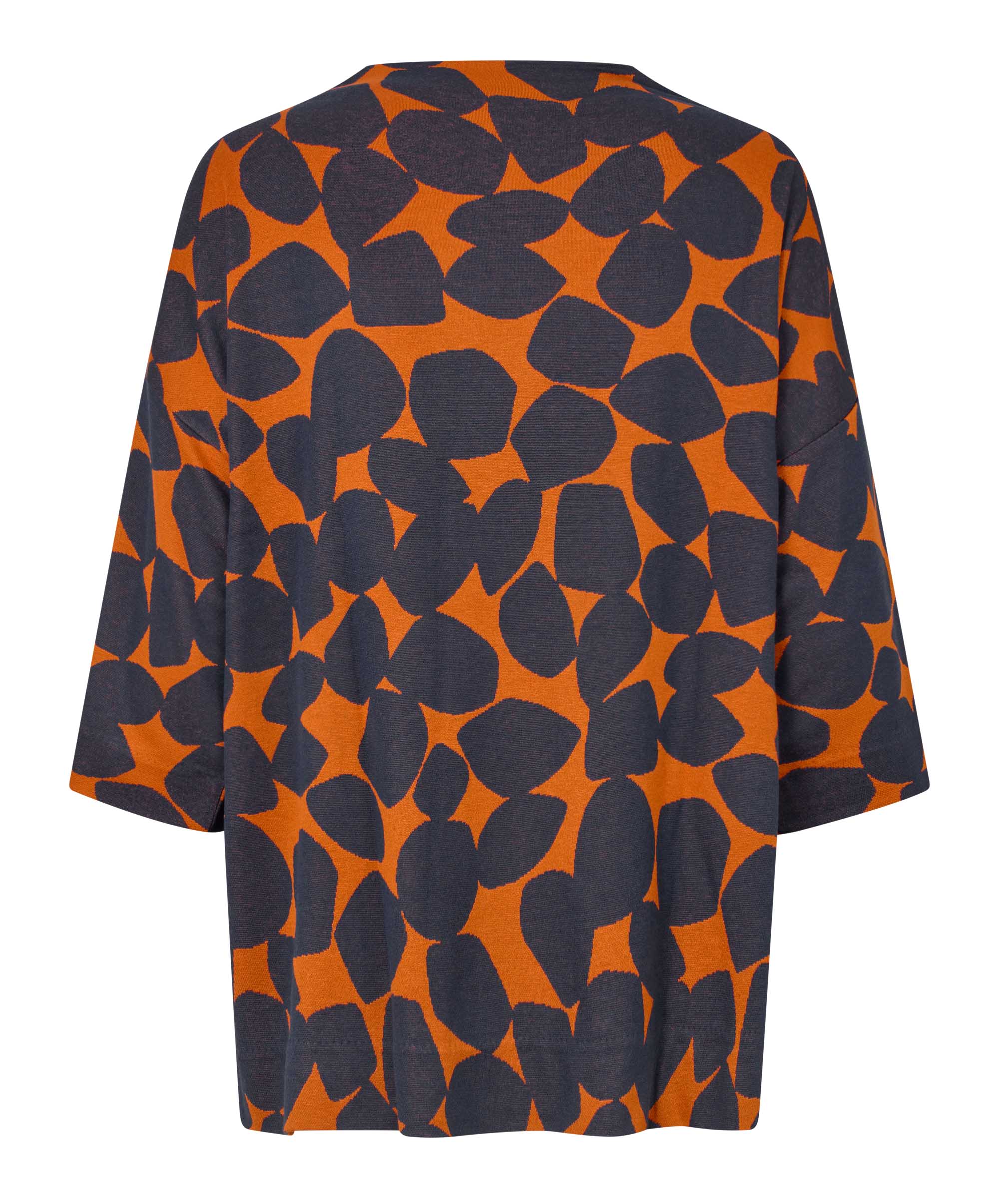 Orange and black patterned shirt on a white background