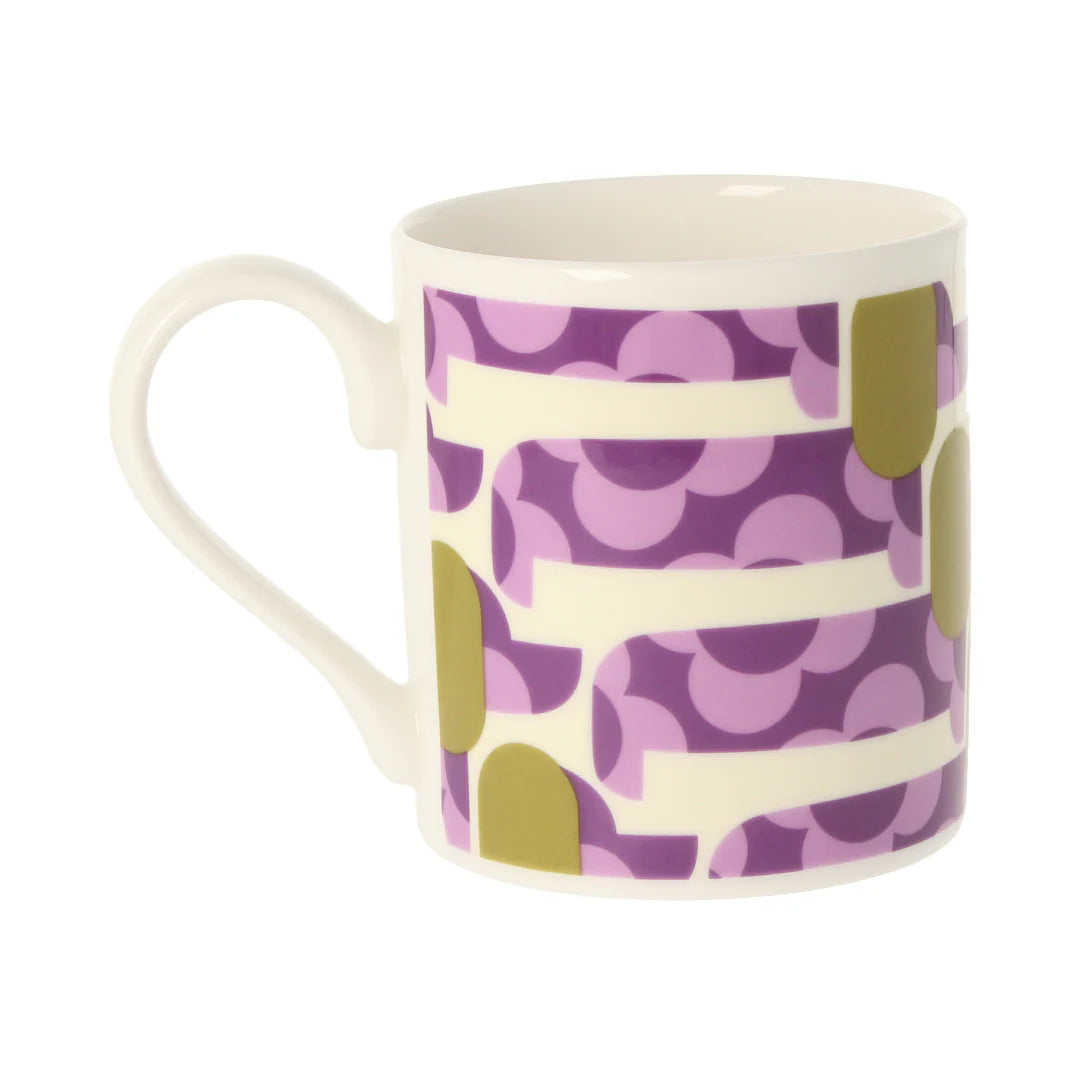 Mug with purple and green pattern on a white background