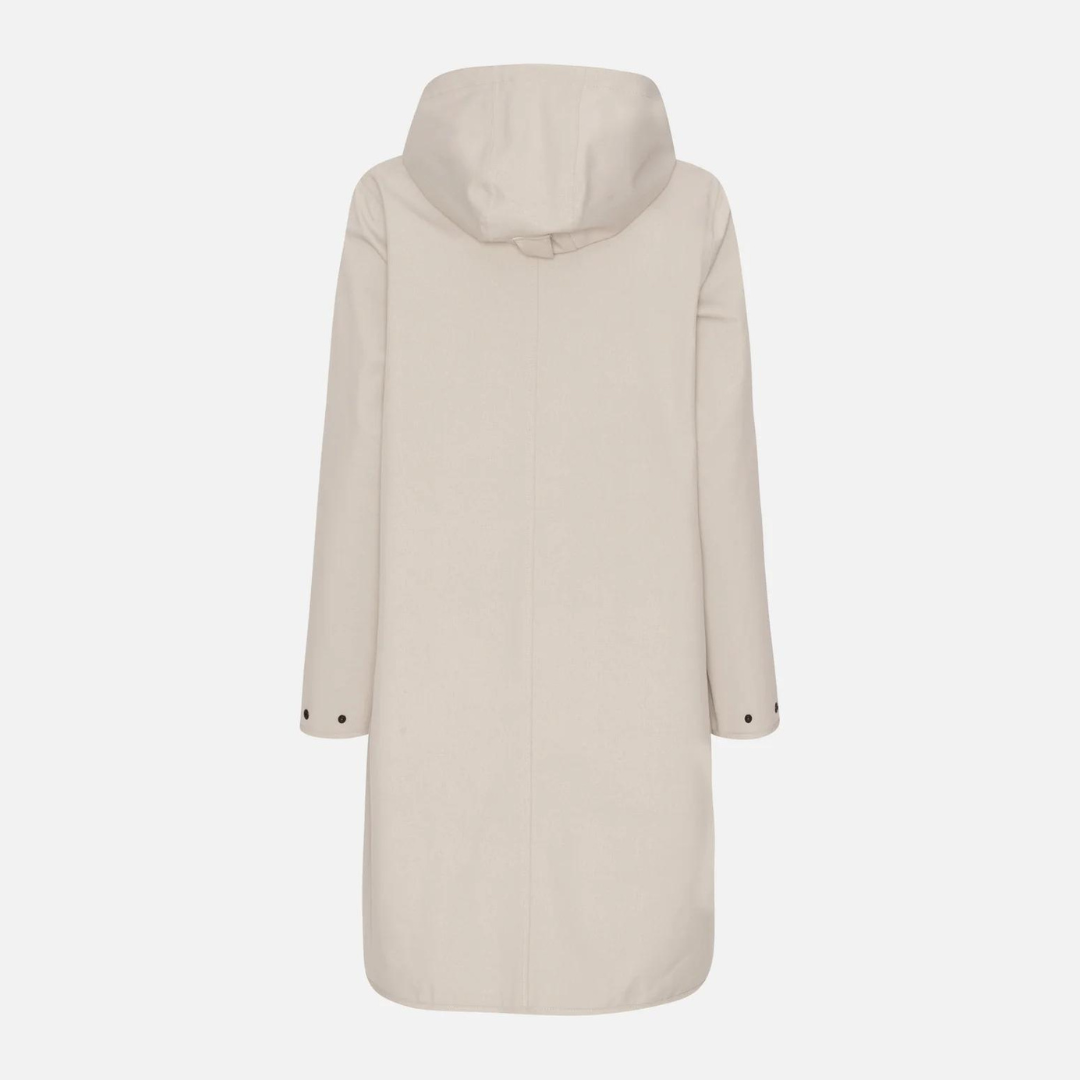 Beige hooded raincoat, long sleeves, rear view, showing simple design and subtle dark button accents.