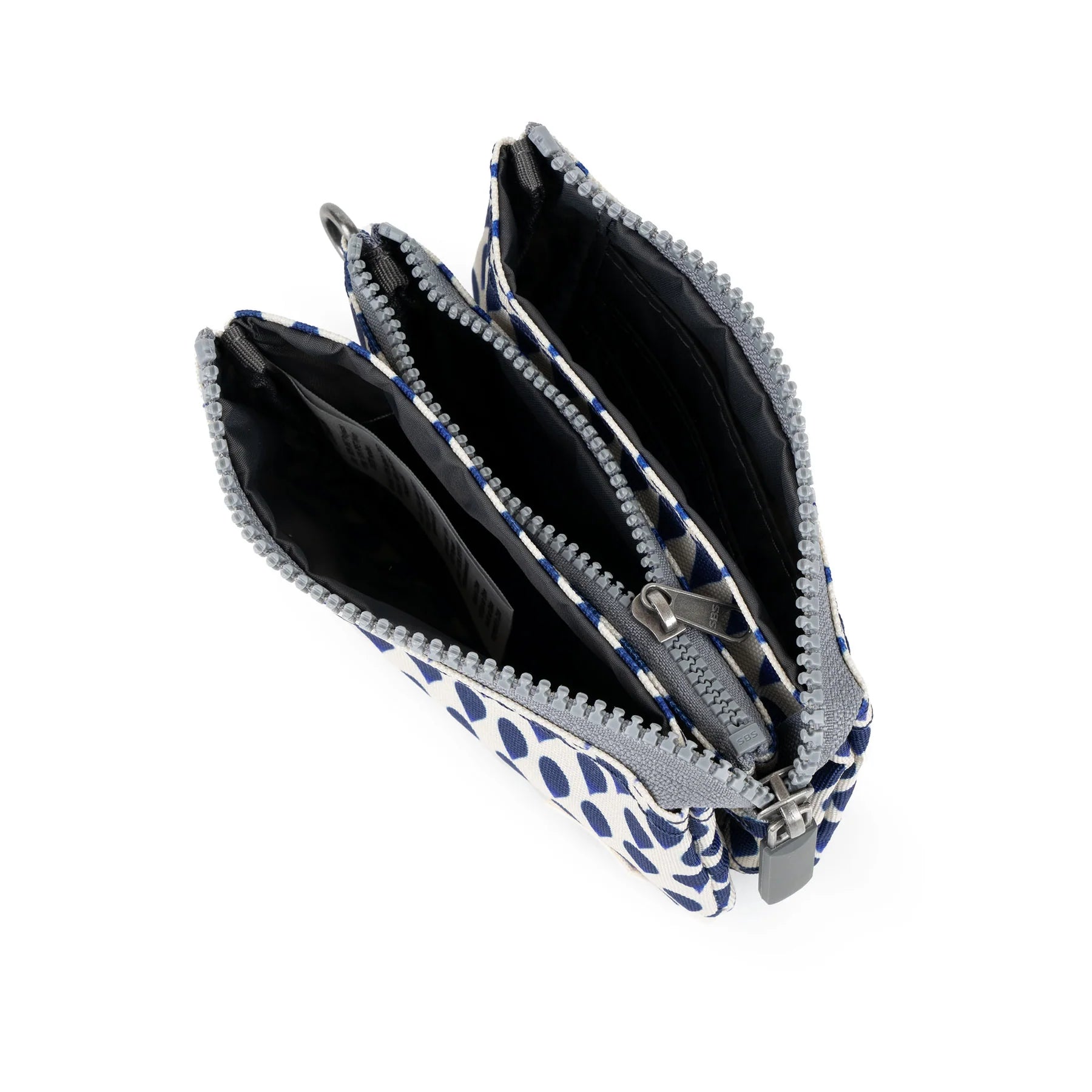ROKA zippered wallet with multiple compartments, featuring a stylish blue and white polka dot design.