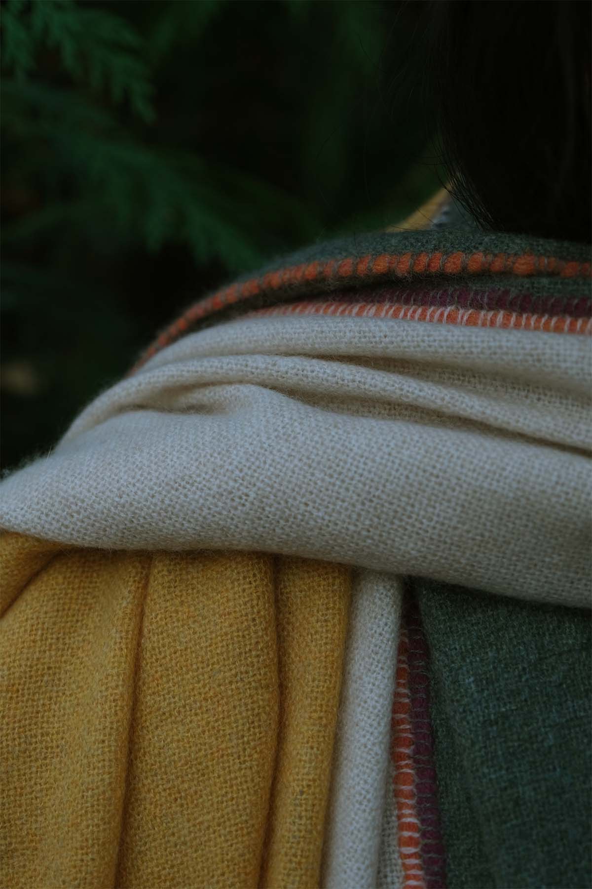 Close-up of fabric with visible stitching and color variations.