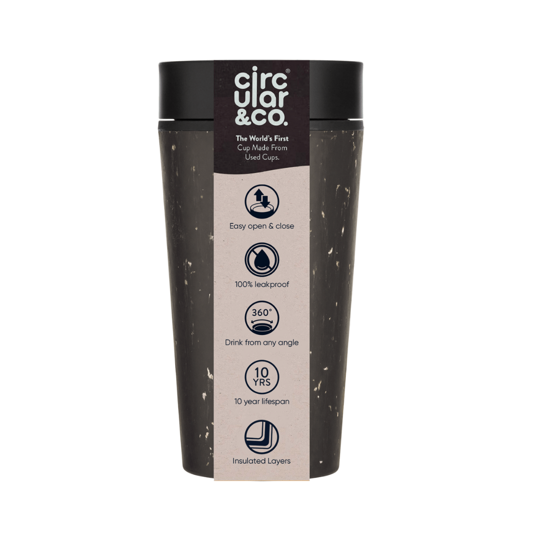 Dark gray reusable coffee cup made from recycled cups; black lid; features leakproof design, 360° drinking, and insulated