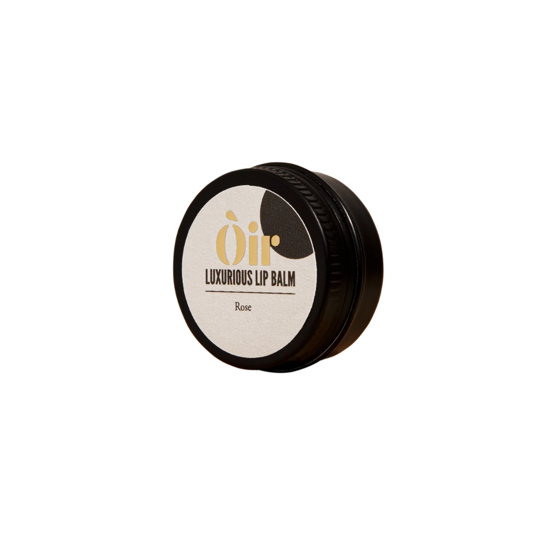 Luxurious lip balm container with visible brand logo on a white background