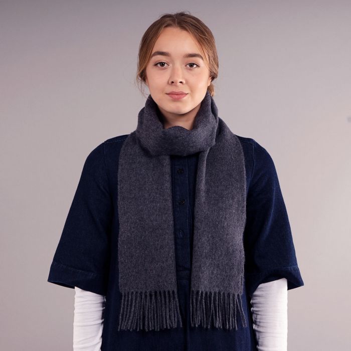 Dark gray wool scarf with fringed edges.