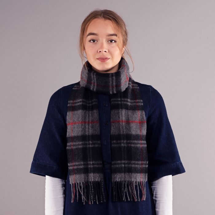 Grey and red plaid wool scarf with fringed edges.