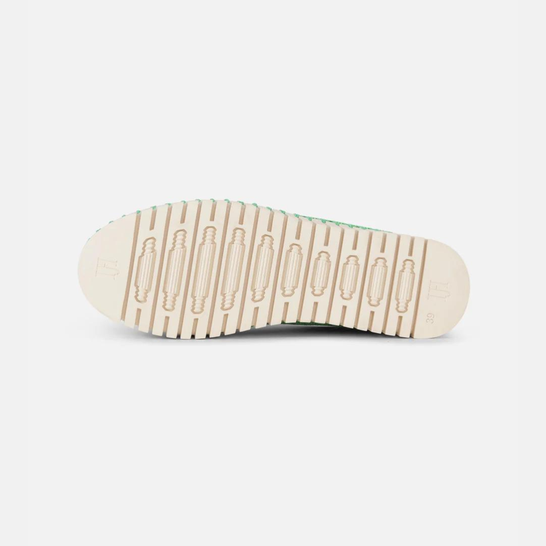 Cream-colored sole of a light green woven sneaker, size 39, showing textured tread and subtle branding.