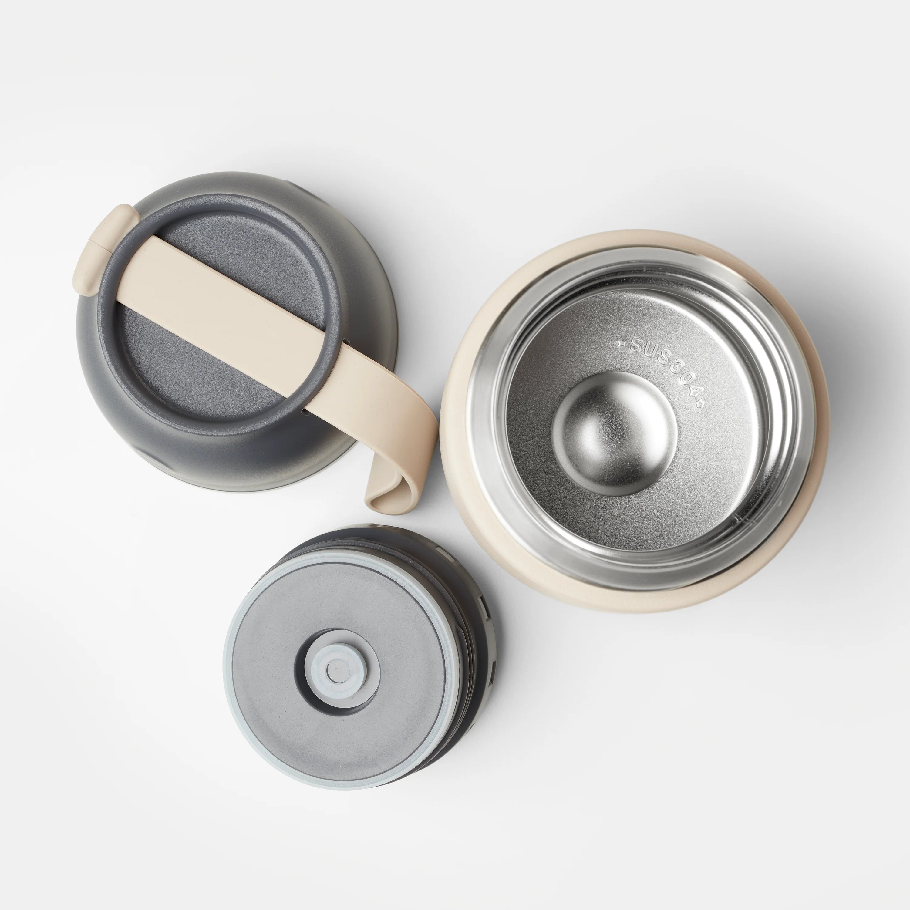 Beige and gray vacuum insulated bottle with stainless steel interior, shown disassembled with lid and base components.