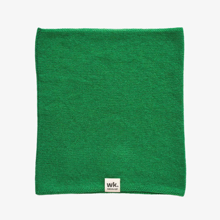 Bright green knitted neck warmer.  Small label with "wk. Edinburgh" is visible at the bottom.