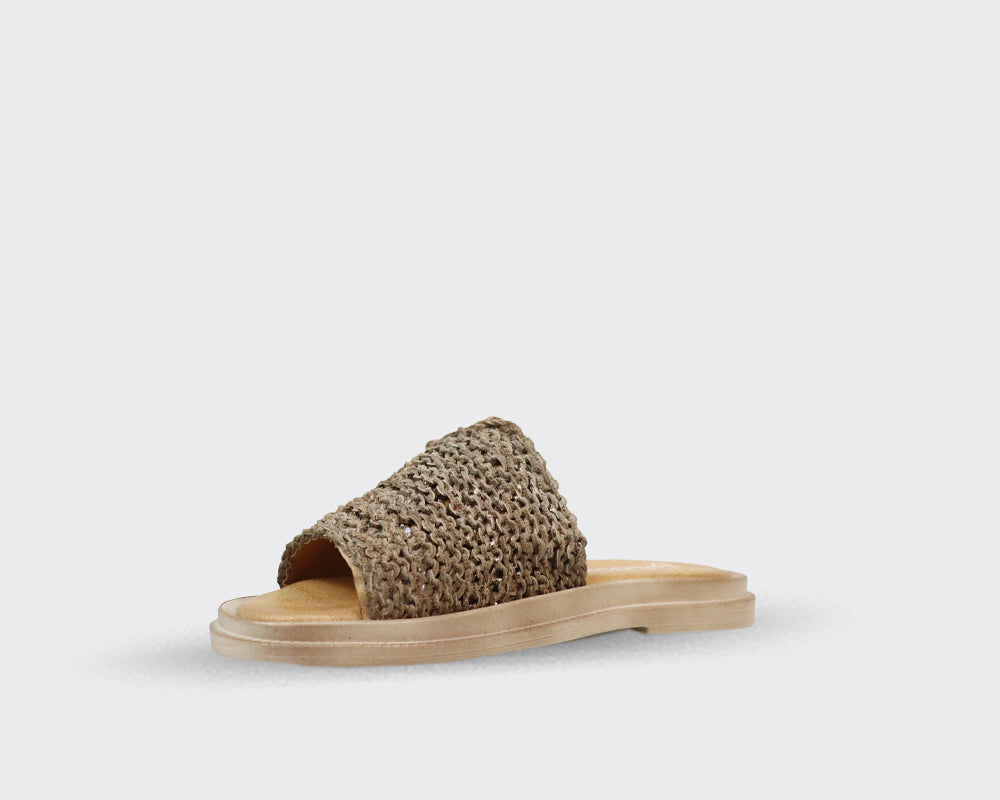 Beige woven slide sandal with a flat, light beige sole.